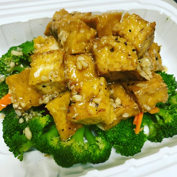Tiki Tiki Thai Cuisine's golden fried tofu with garlic sauce, served over steamed broccoli and carrots.